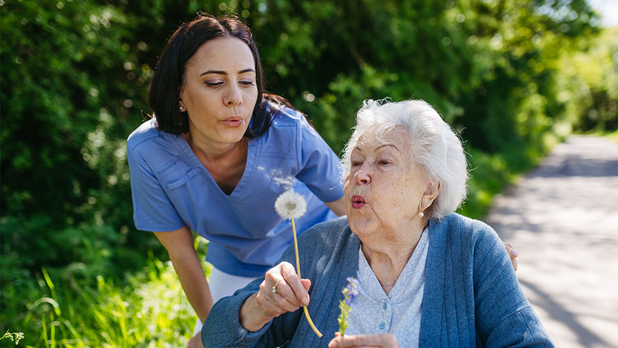 Carer with patient our walking