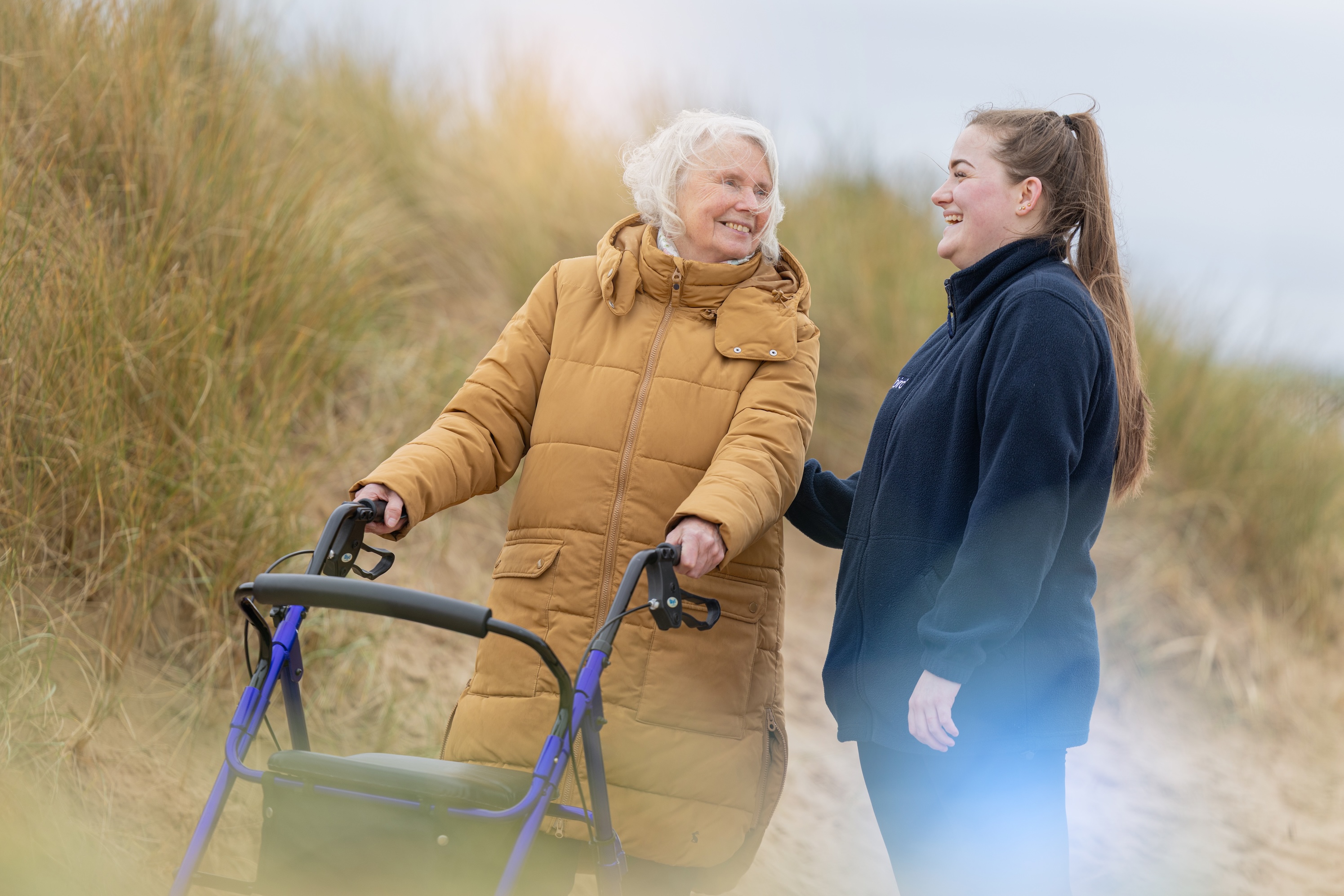 Bluebird Care Isle of Wight Carer and Client Beach Walk