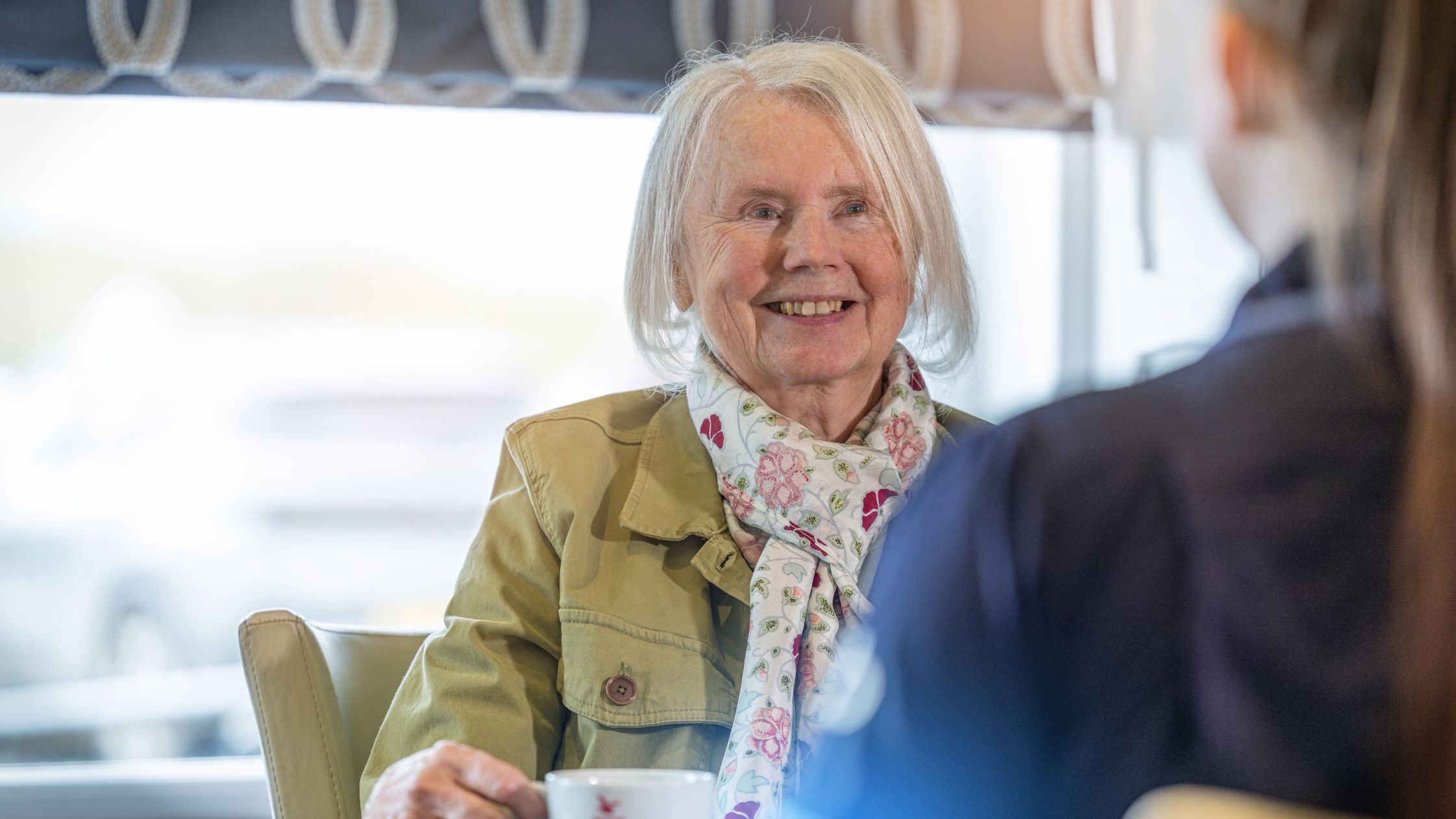 Elderly Lady with a carer out and about having tea Elderly Lady with a carer out and about having tea