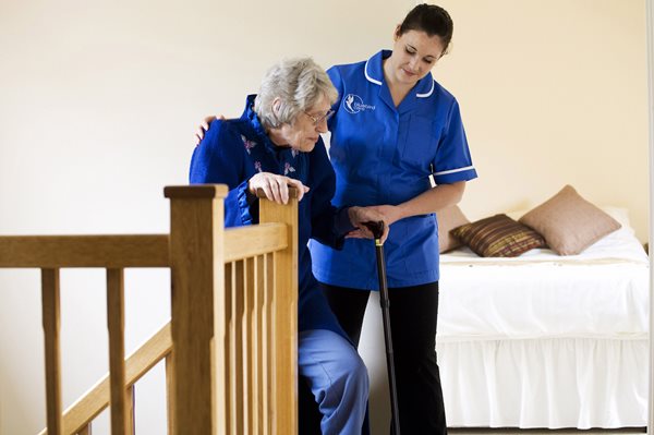 End of life care, helping customer up stairs