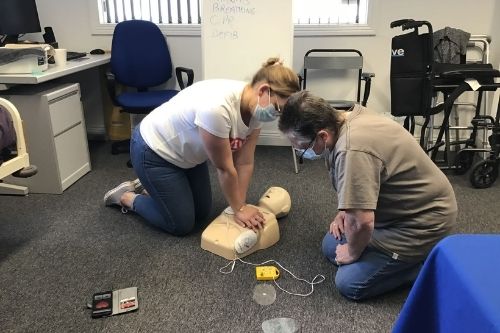Two Bluebird Care Gosport trainee care assistants train in CPR