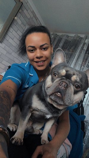 A Bluebird Care Live in care assistant with her pet dog