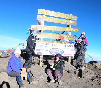 Andrea and her team at the top of Kilimanjaro
