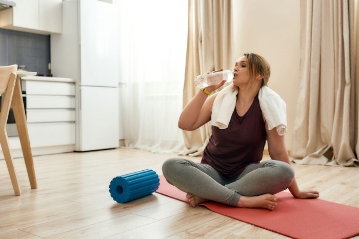 A woman takes a break during yoga