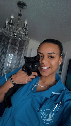 A Bluebird Care assistant with her pet cat