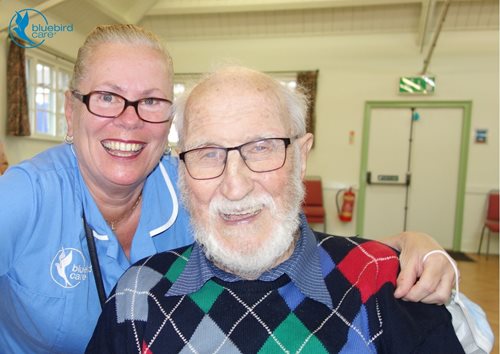 A Bluebird Care carer with a happy customer