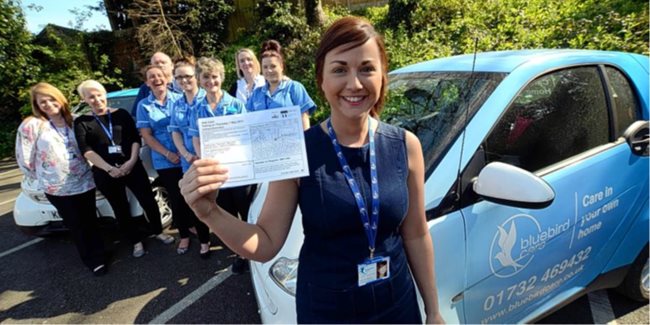 Sevenoaks' Deputy Care Manager and Senior Care Coordinator, Leah Tickle, holds up a polling card.
